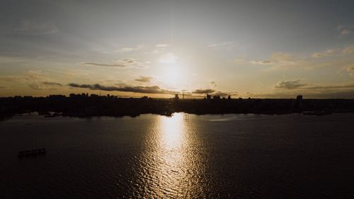 Free A beautiful sunset casts golden reflections over the waters of Manaus, Brazil. Stock Photo