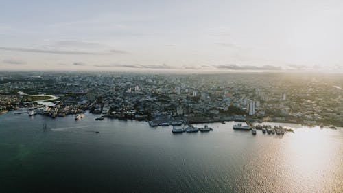 Coastal City Buildings on Shore on Sunset