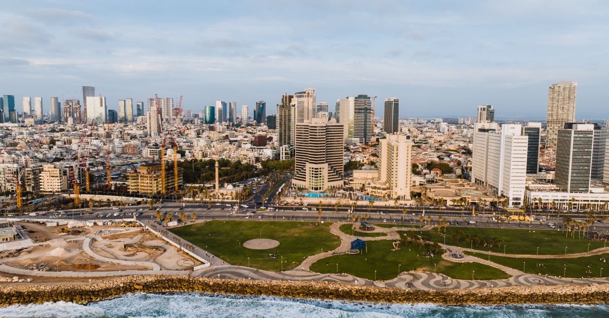 Explore the vibrant skyline of Tel Aviv from above, showcasing its modern architecture and scenic coastline.