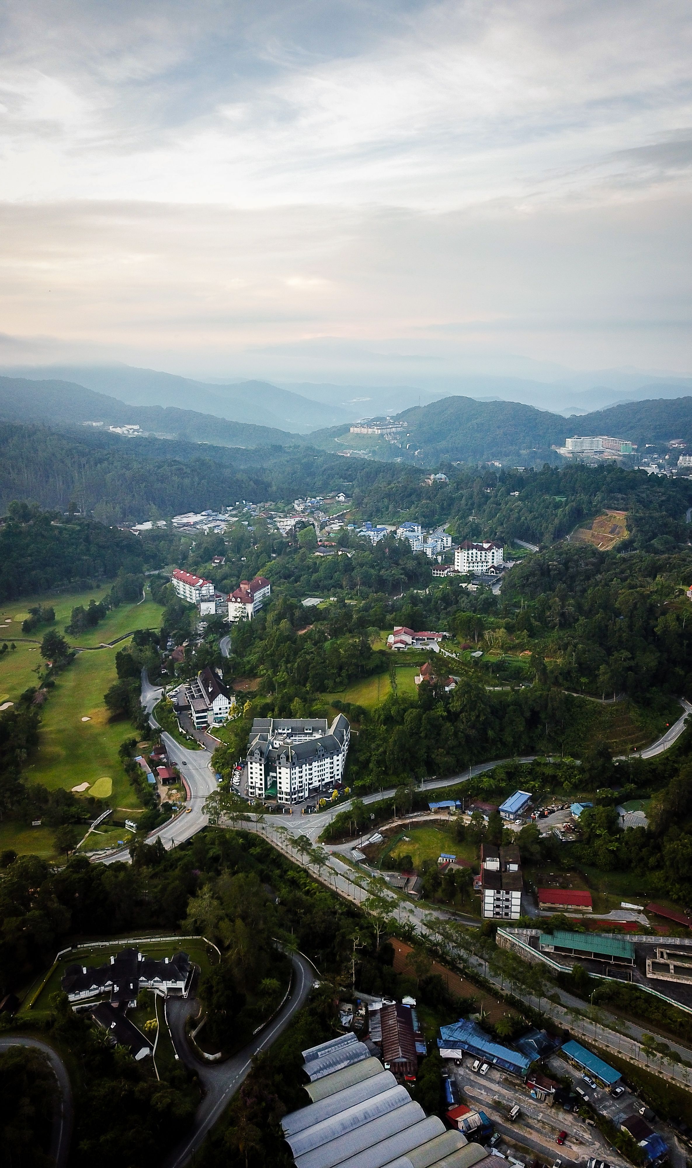Aerial View of City in Mountain Valley · Free Stock Photo