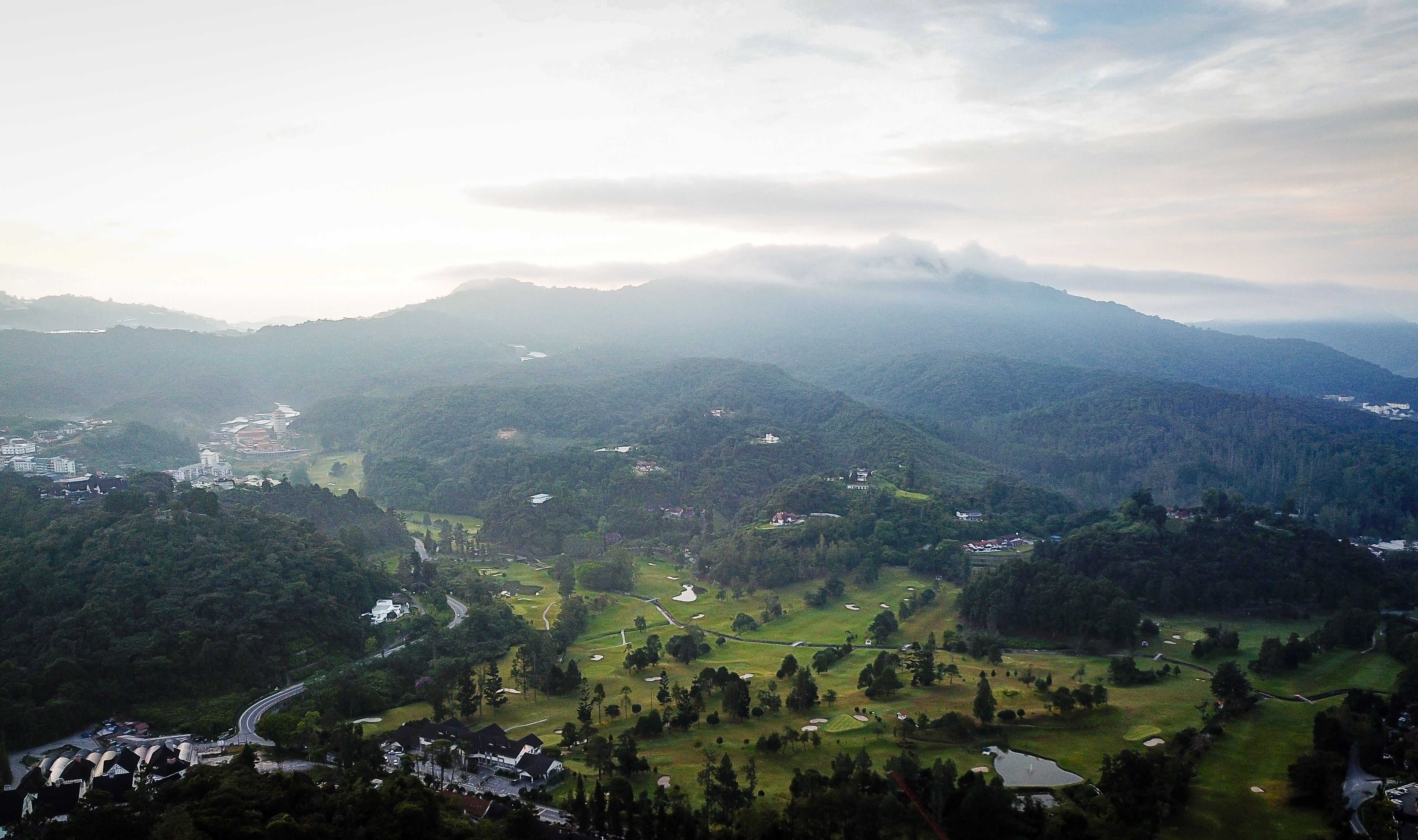 Aerial View of Villages Scattered in Mountain Valley · Free Stock Photo