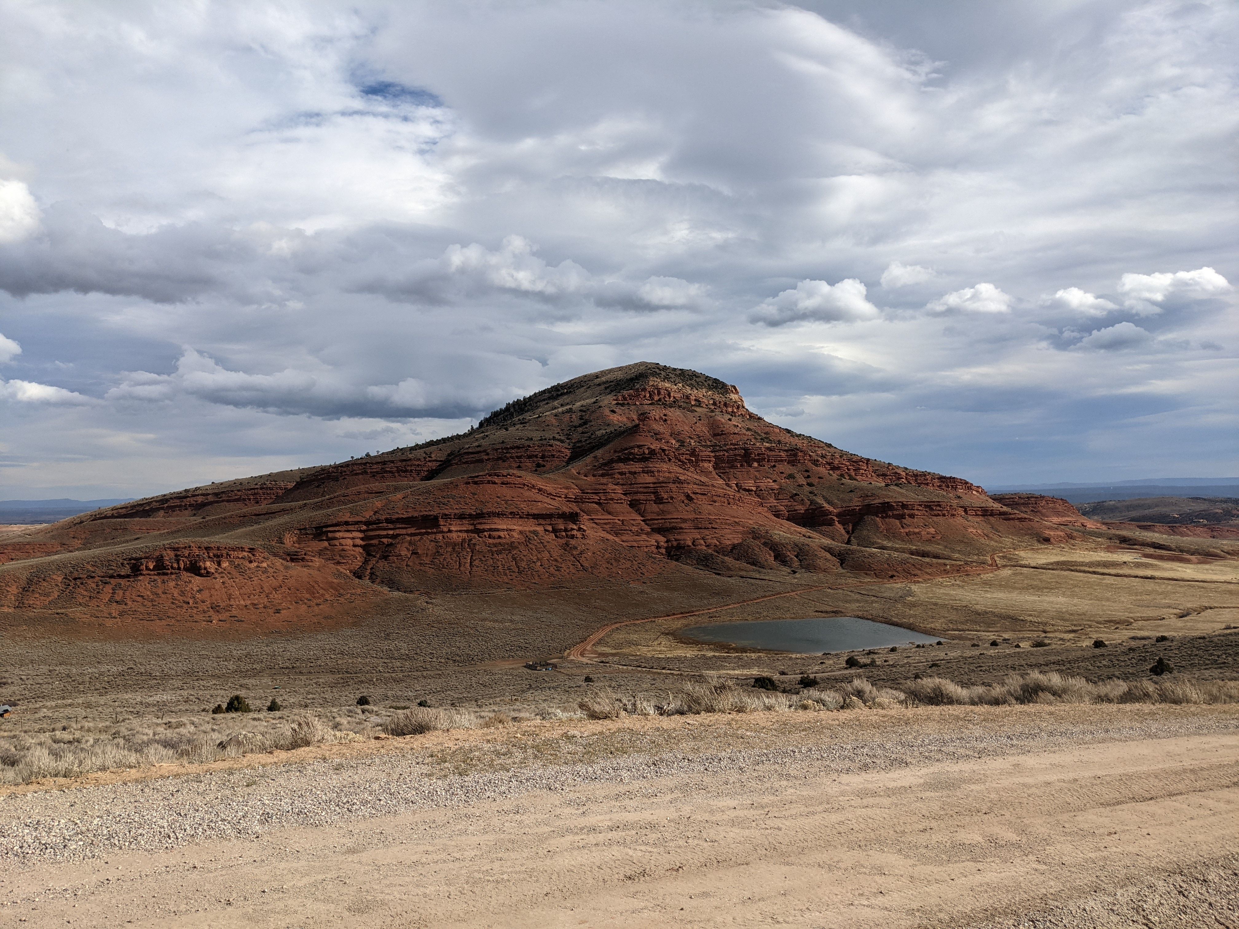 Stunning red butte landscape in Lander, Wyoming, under dramatic skies.