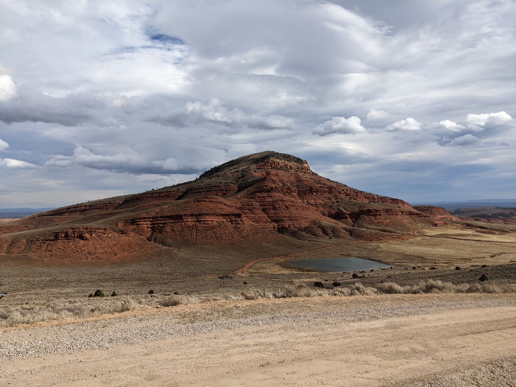 Stunning red butte landscape in Lander, Wyoming, under dramatic skies.