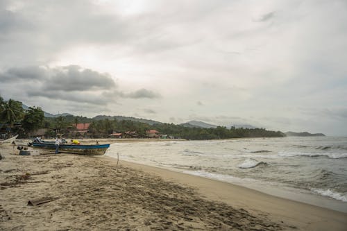 Fotos de stock gratuitas de arena, barcos, dice adiós