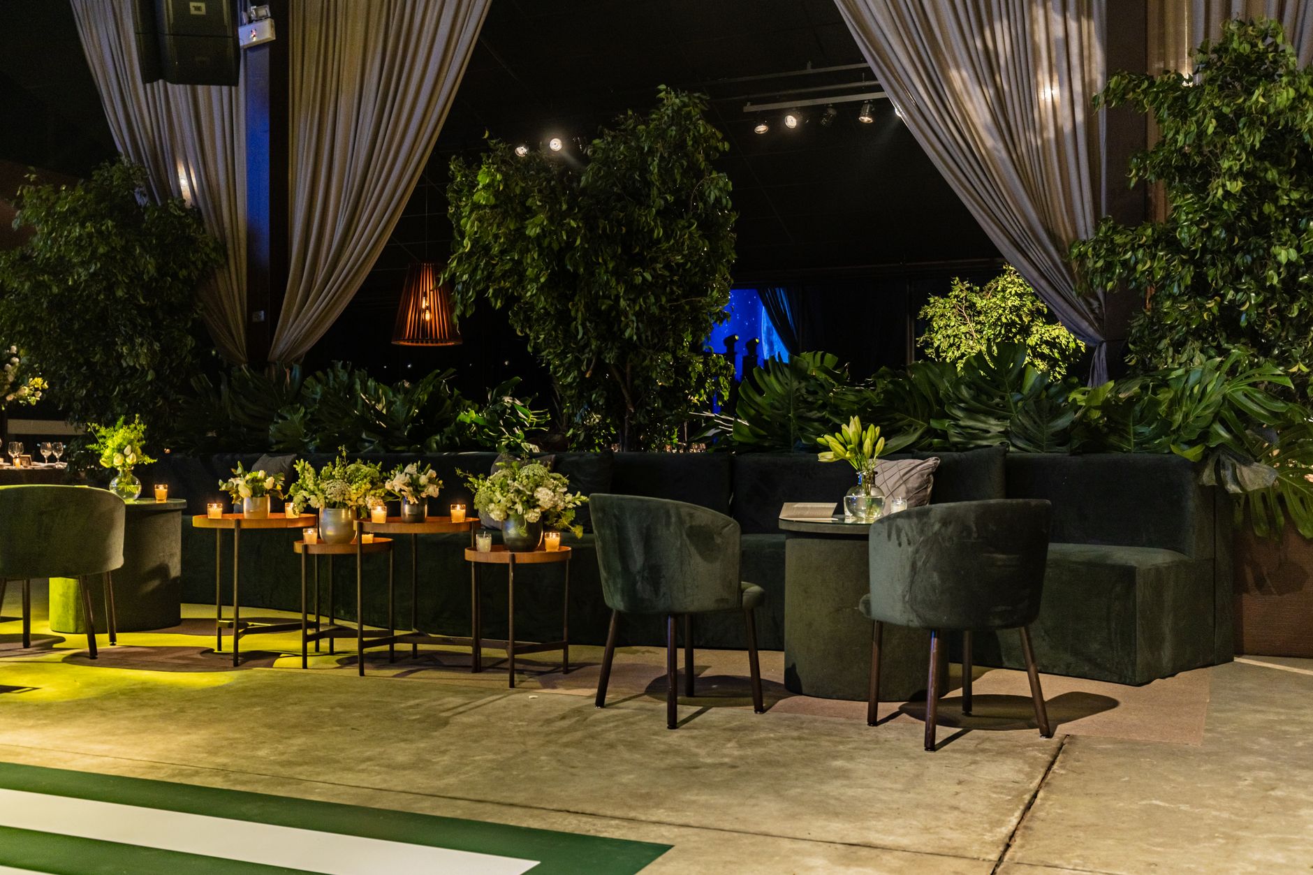 A minimalist and sophisticated interior of a high-end private club with dark wood and soft lighting.