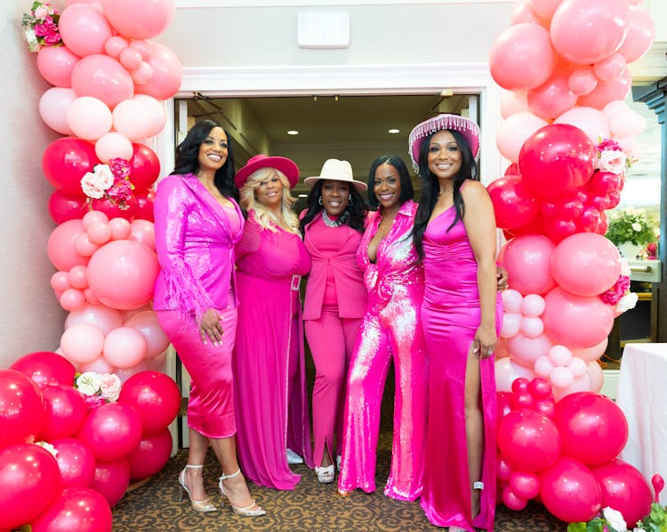 Women Dressed In Pink At A Party