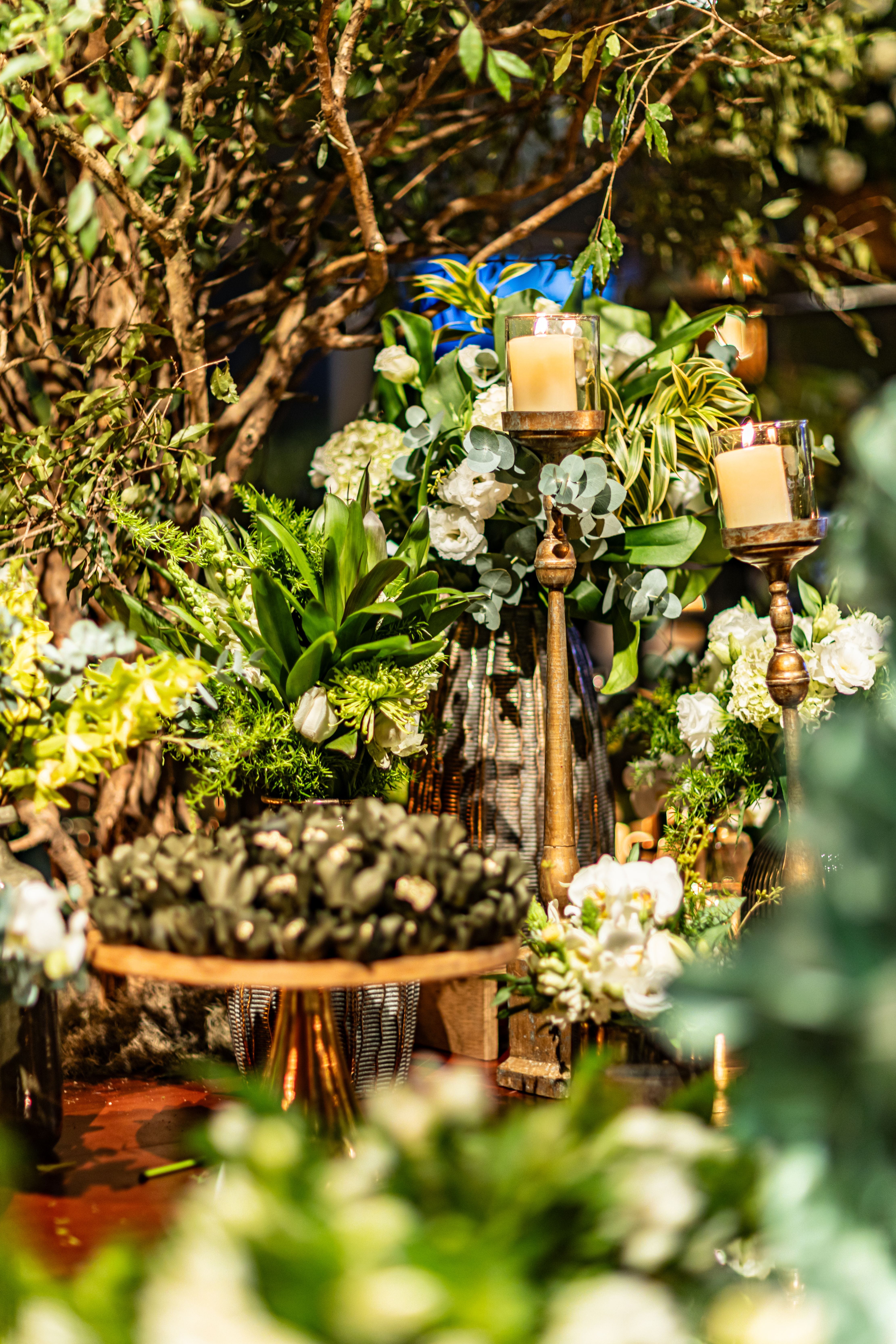 Elegant celebration setup with flowers and candlelight, perfect for special occasions.