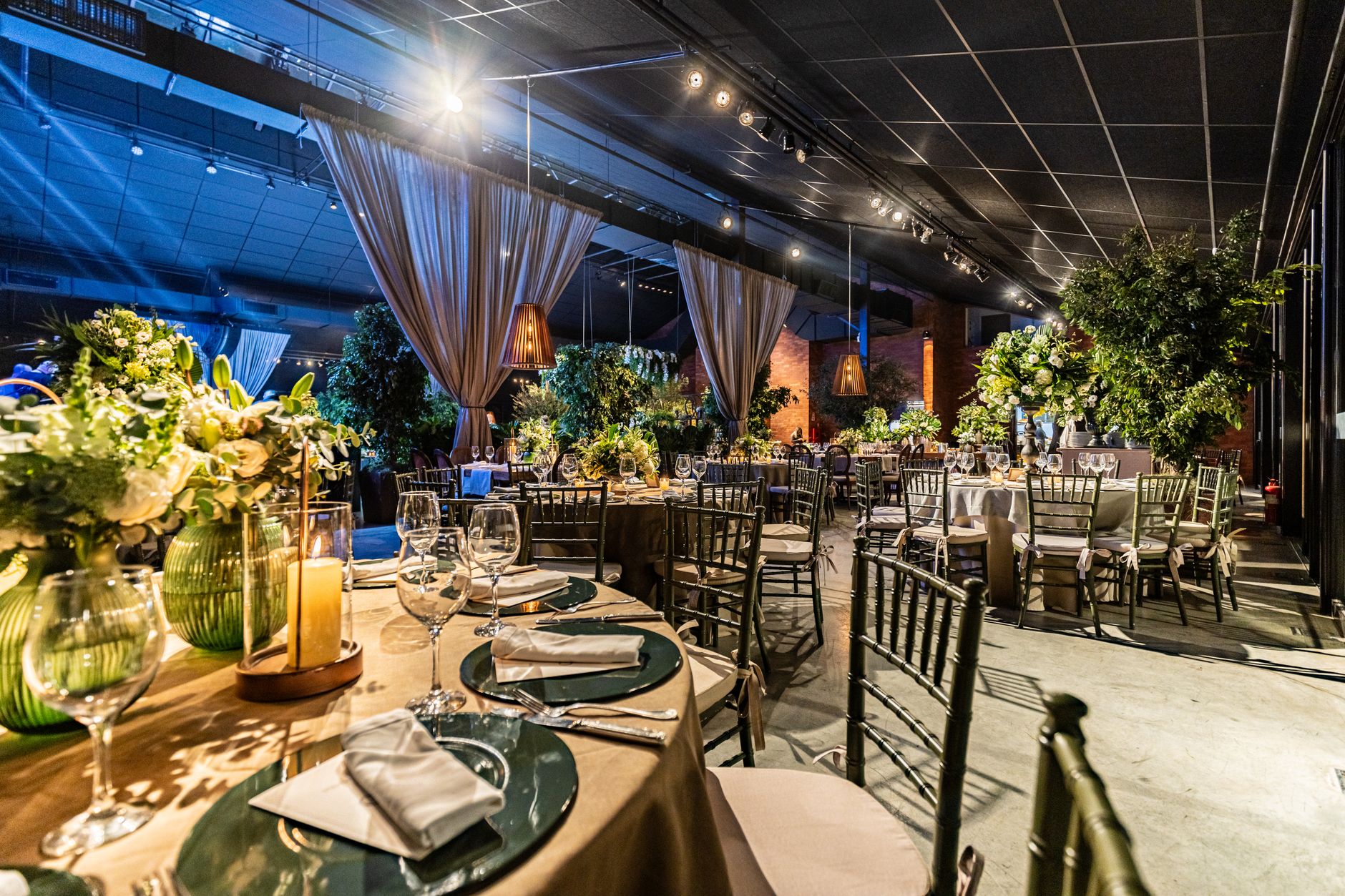 company funday activities cairo — Luxurious indoor banquet with lush greenery, elegant table settings, and warm lighting.