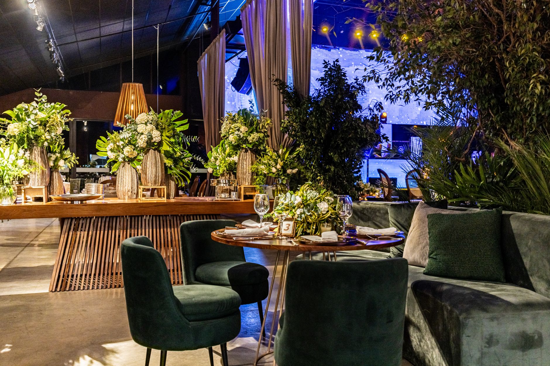 Luxurious indoor setting featuring ornate floral arrangements and elegant seating, perfect for special occasions.