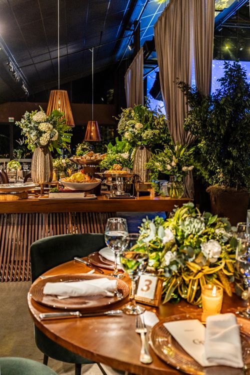 Free A beautifully decorated table with floral arrangements in a sophisticated restaurant setting, perfect for special occasions. Stock Photo