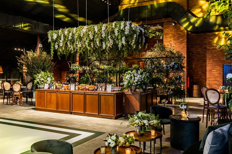 The Bar Decorated With Flowers In A Restaurant During A Special Occasion 