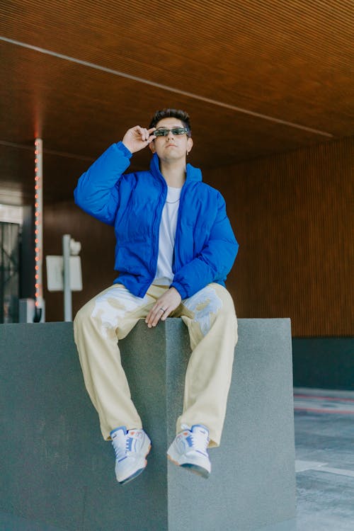 Man Posing in Sunglasses and Blue Jacket