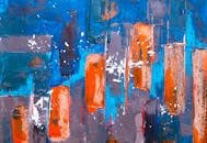 这幅当代墙壁艺术的动态抽象画，以生动的蓝色和橙色呈现