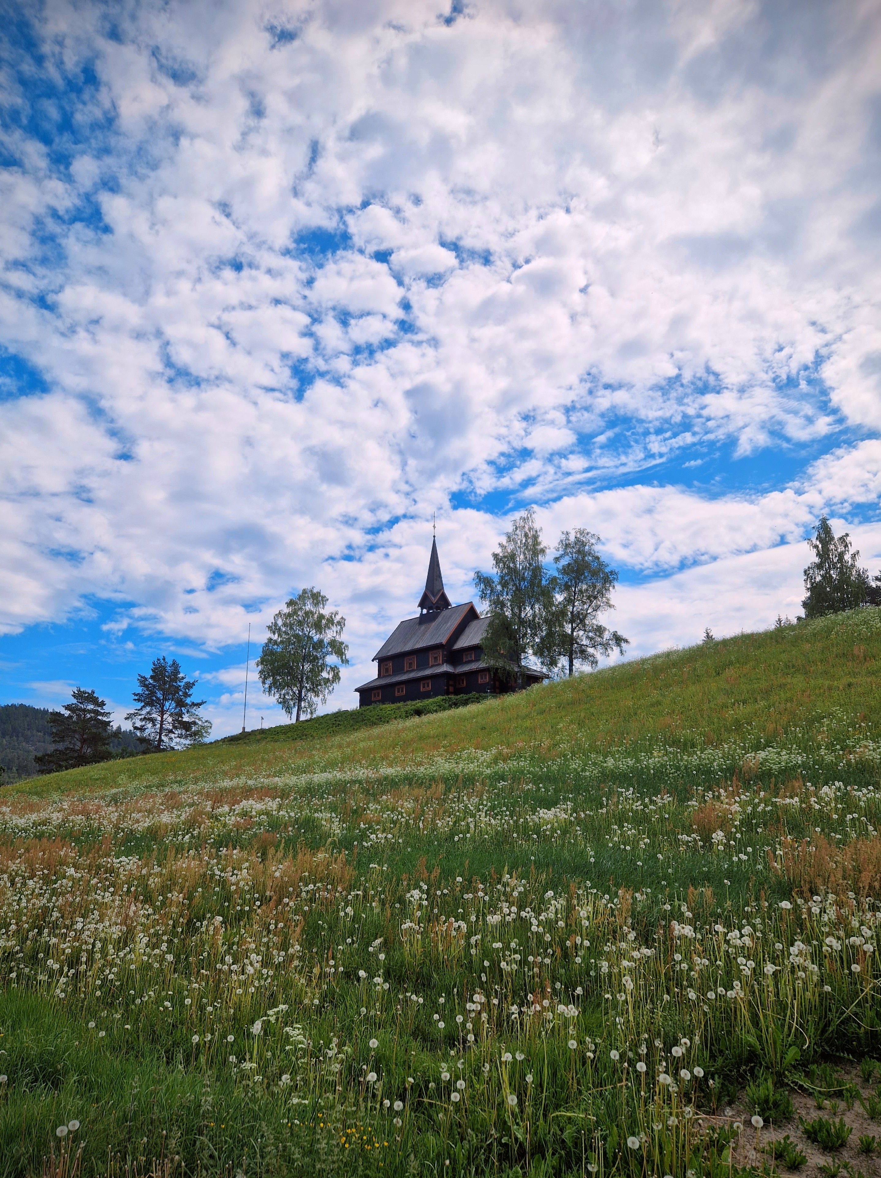 Wooden Church on a Hill in a Rural Area · Free Stock Photo