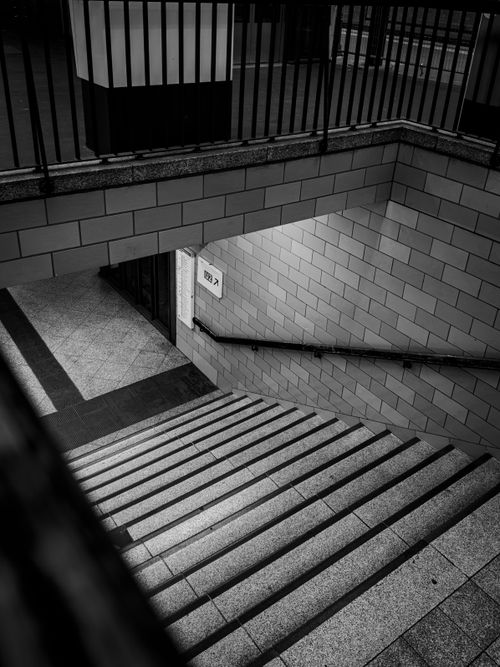 Free Stylish black and white photo of a Berlin underground staircase, showcasing geometric lines. Stock Photo