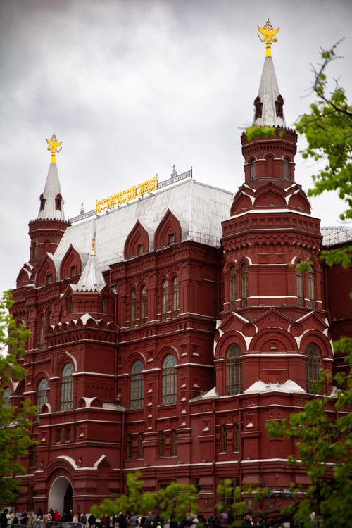 Free View of a red brick historical building in Moscow, featuring ornate spires. Stock Photo