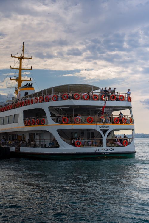 Free A ferry with passengers on the Bosphorus in Istanbul, Turkey, under a cloudy sky. Stock Photo