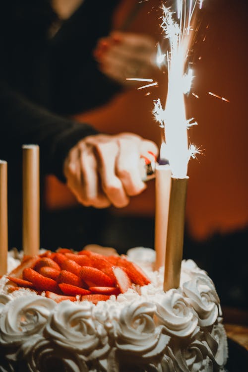 Free Person Lighting The Sparklers Stock Photo