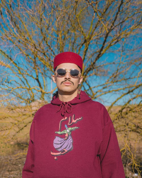 Man with Mustache Wearing Hoodie and Cap