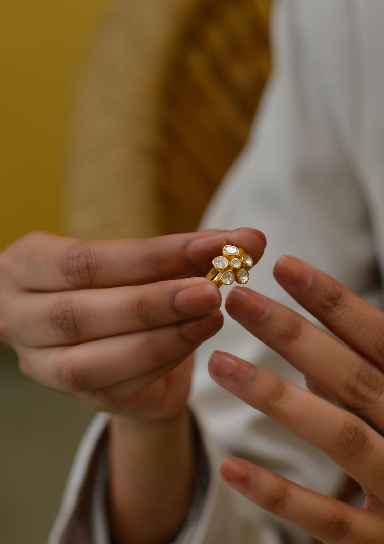 Woman Putting Ring On Finger