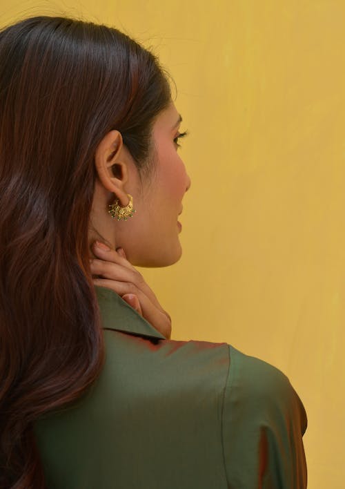 Woman Wearing Golden Earring