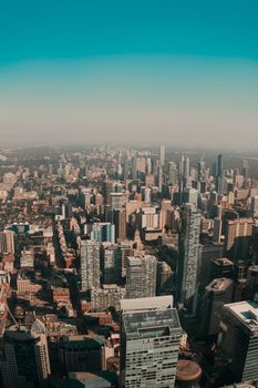 Dramatic aerial view of Toronto's skyline showcasing skyscrapers and downtown urban landscape.