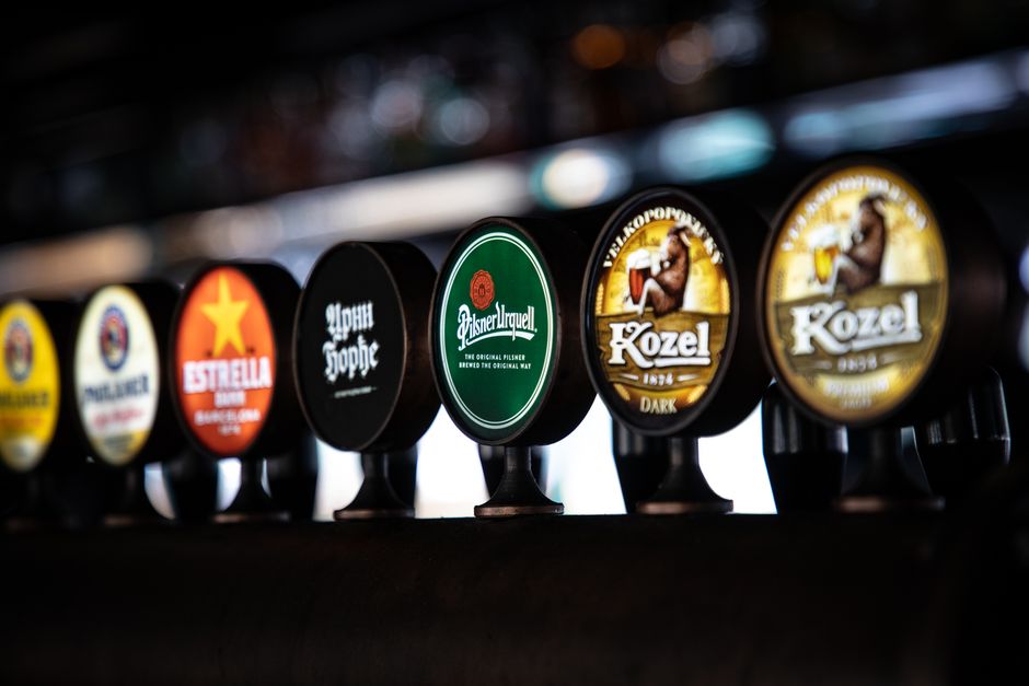 Glasses of local Lithuanian craft beer on a wooden bar counter in Vilnius