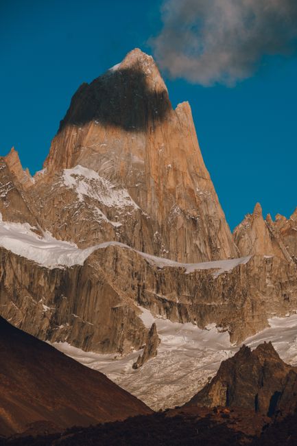 Dramatic mountain peak with snow in Patagonia, highlighting nature's grandeur.
