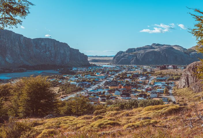 Explore a charming village nestled in a scenic Patagonian valley, surrounded by stunning mountain views.