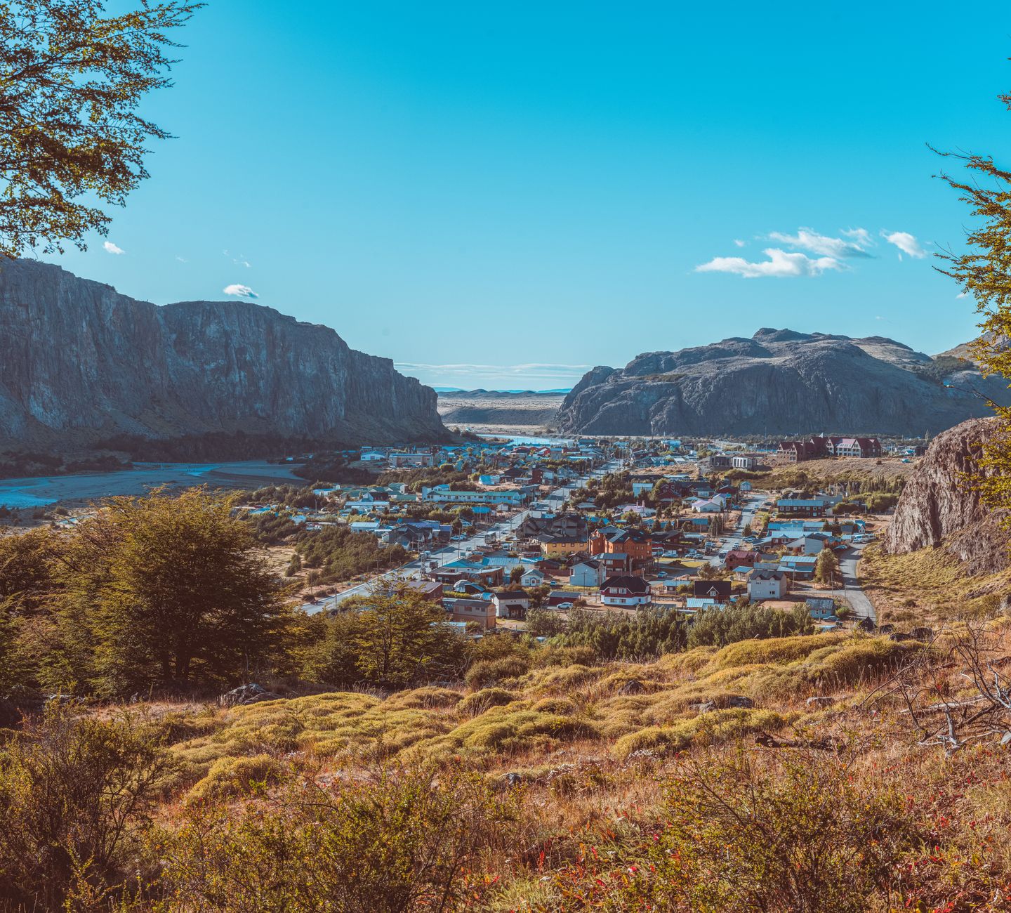 Explore a charming village nestled in a scenic Patagonian valley, surrounded by stunning mountain views.