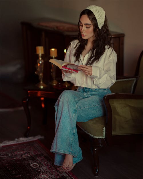 Woman Sitting and Posing with Book