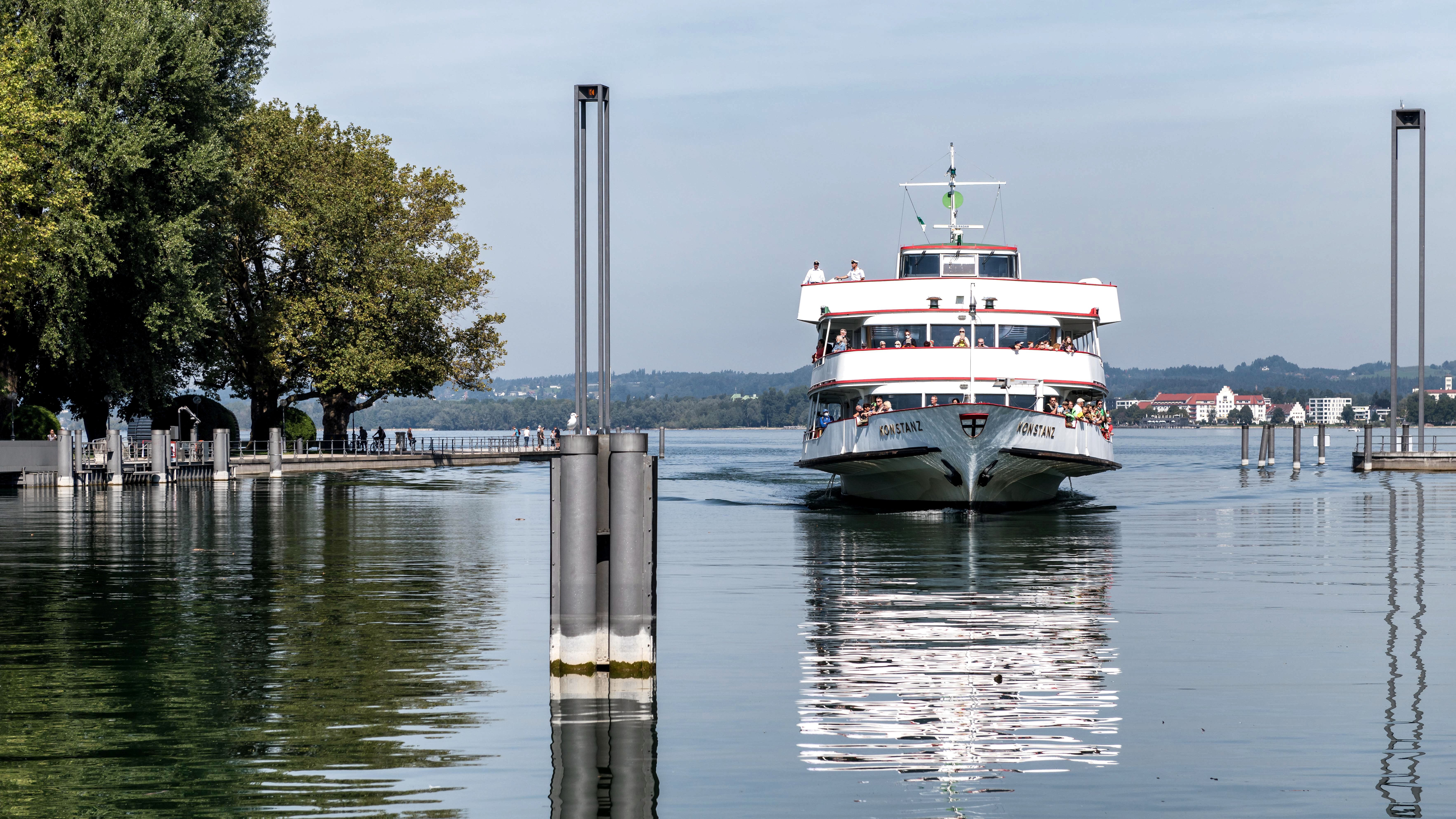 A picturesque cruise on Lake Constance in Bregenz, Austria, featuring a ferry and serene waterscape.