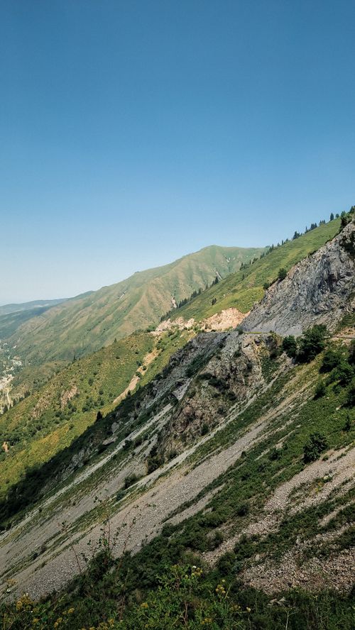 Free Explore the scenic mountain landscape of Almaty Province, Kazakhstan, under a clear blue sky. Stock Photo