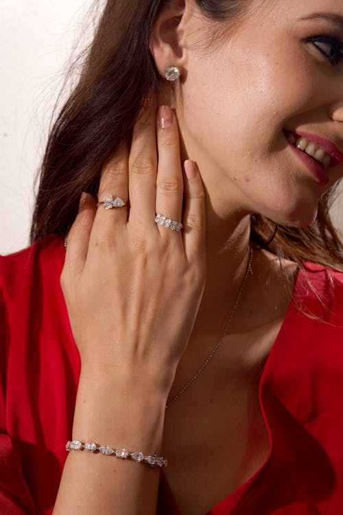 Young Woman Posing and Wearing Rings and a Bracelet · Free Stock Photo