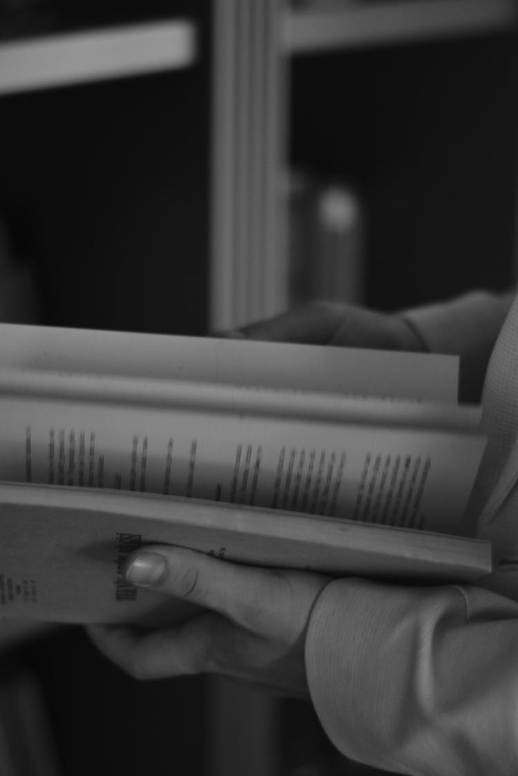 Close-up Of Woman Holding A Book 