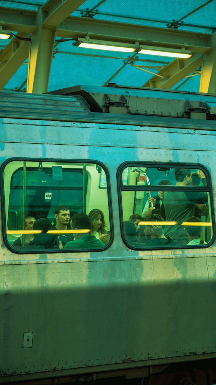 People In A Subway Photographed From The Outside