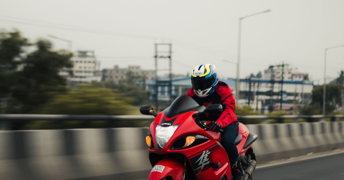 Hayabusa Riding Position Man Riding Red Suzuki Hayabusa · Free Stock Photo