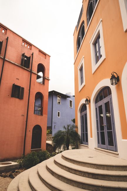 Charming architectural view showcasing vibrant buildings in a serene urban environment.