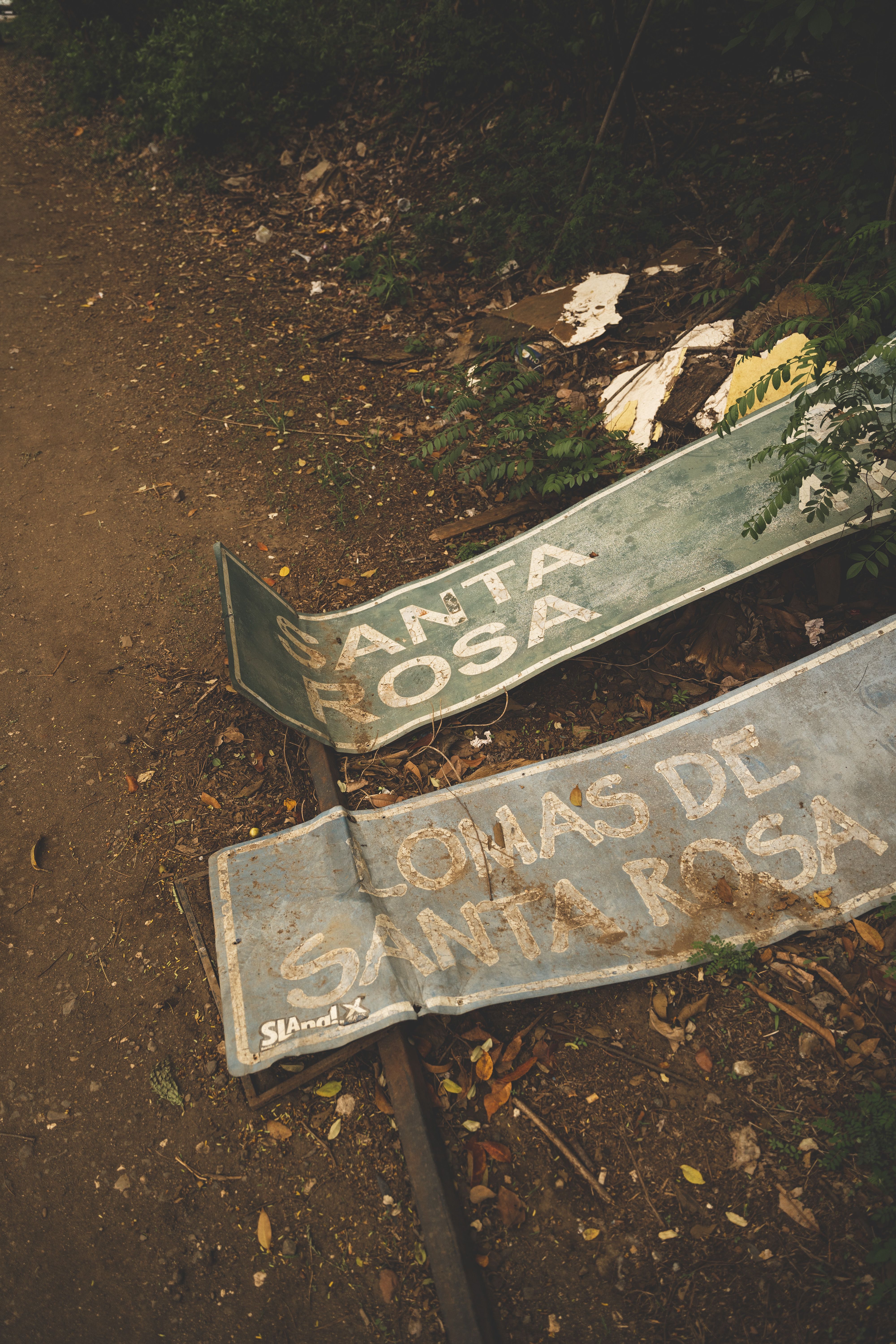 Dirty Broken Road Signs on Ground · Free Stock Photo