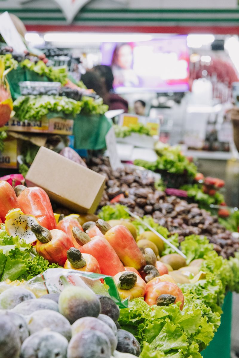 Fresh fruit and vegetables on display at an indoor market