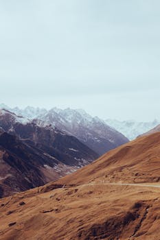 Breathtaking view of snow-capped mountains in Upper Balkaria, perfect for nature and travel themes.