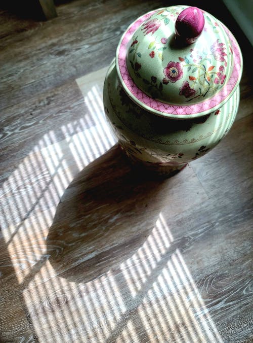 Free stock photo of floor, shadows, vase