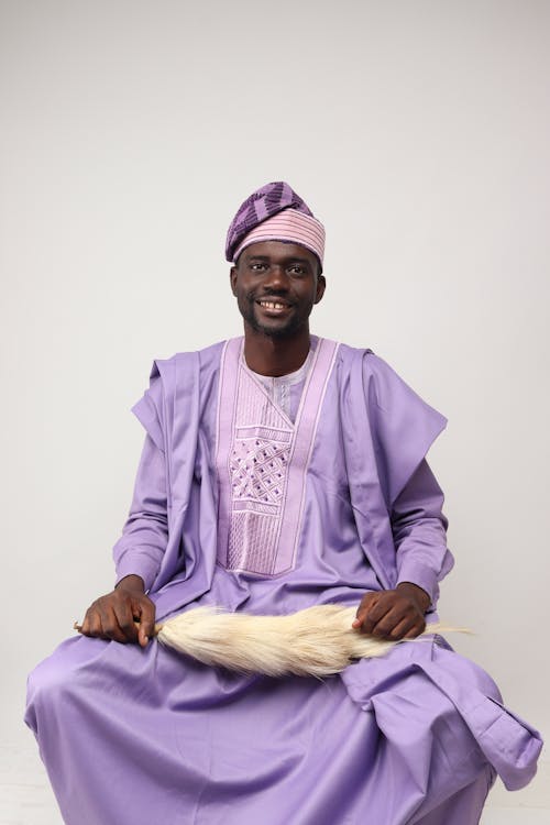 Smiling Man in Purple, Traditional Clothing