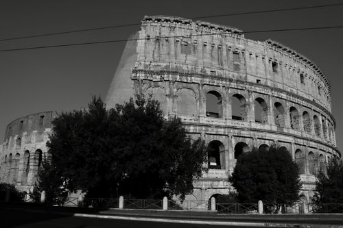 Free Monochrome photo of the iconic Colosseum in Rome showcasing ancient Roman architecture. Stock Photo