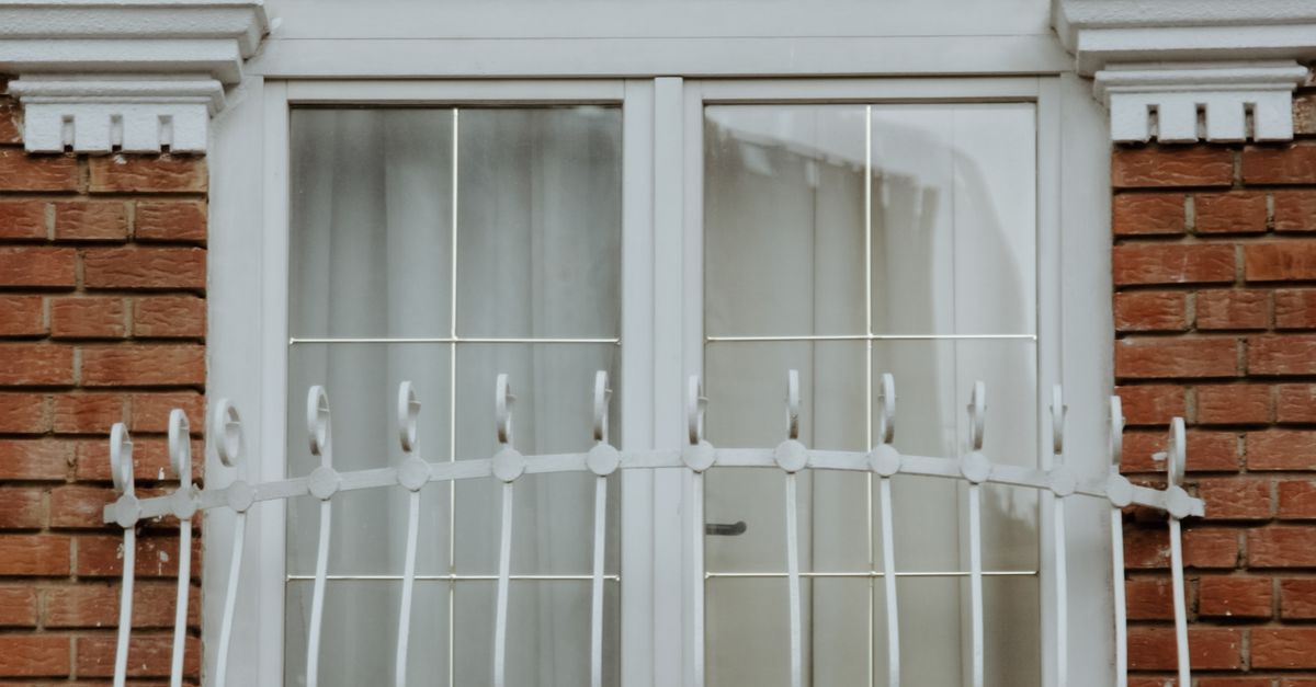 Windows Railing Front A window with a white railing and a white window · Free Stock Photo