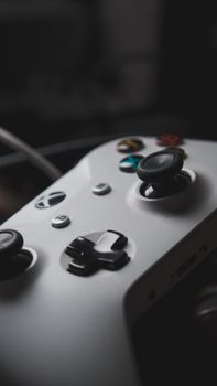 Detailed close-up of a gaming controller, showcasing buttons and joystick.