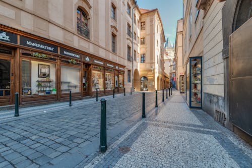 Free View of an Empty Cobblestone Alley between Buildings in the Old Town of Prague Stock Photo
