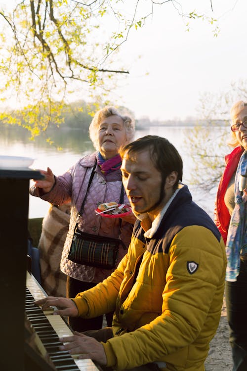 Man in Jacket Playing Piano