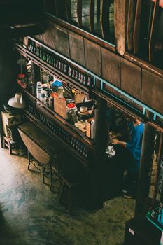 Aerial view of a rustic cafe interior with wooden decor and cozy atmosphere.