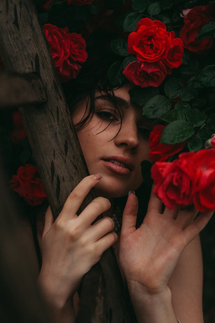 Woman With Red Roses Posing In Nature